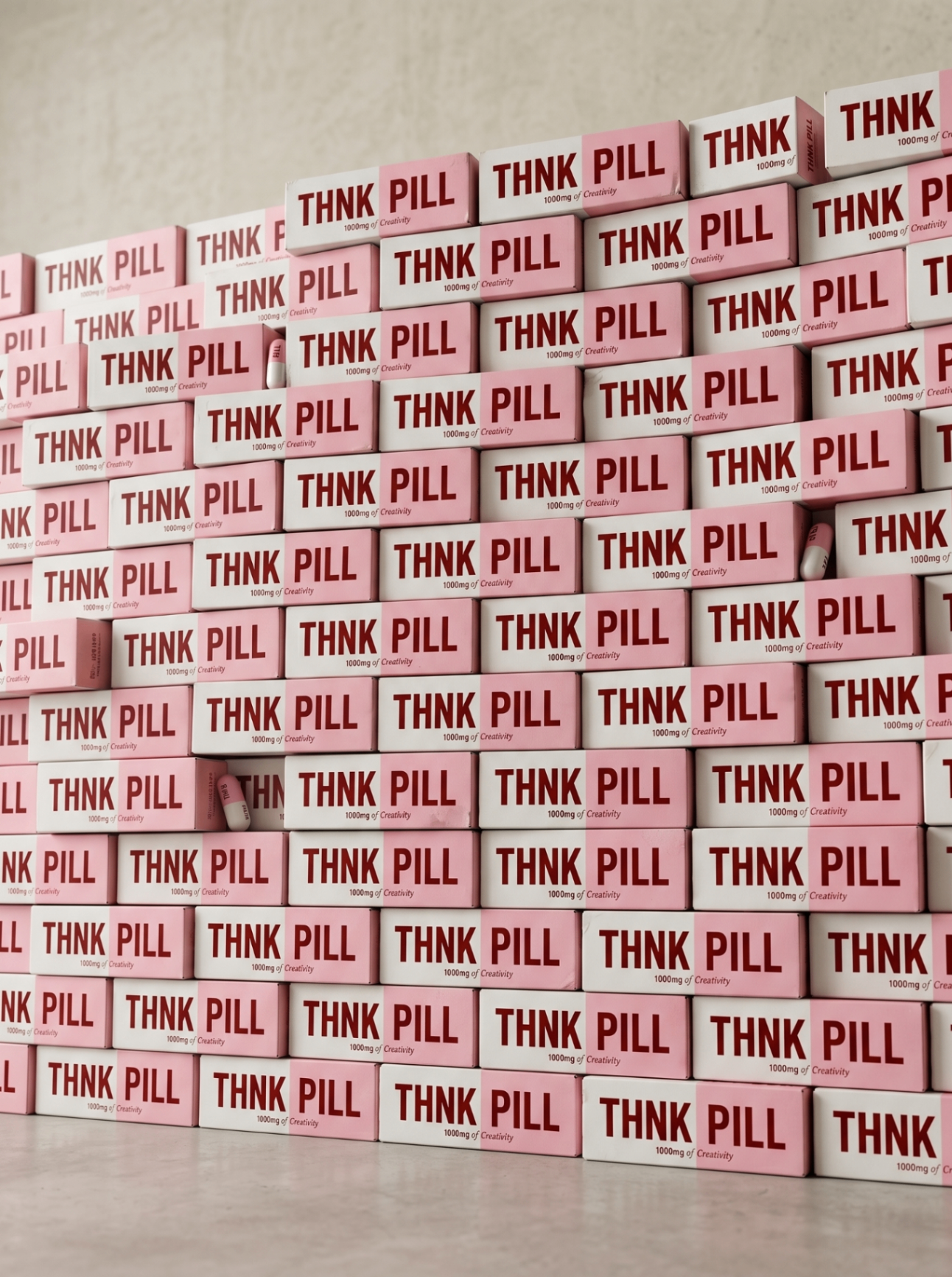 A wall of THNK PILL packaging — 1000mg of Creativity